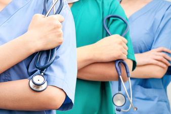 Nurse practitioners holding stethoscopes